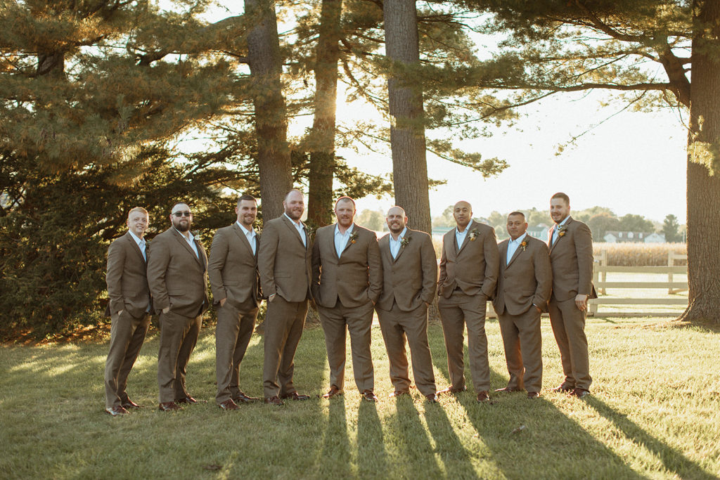 outdoor wedding groomsmen in brown suits photographed by Charlottesville wedding photographer