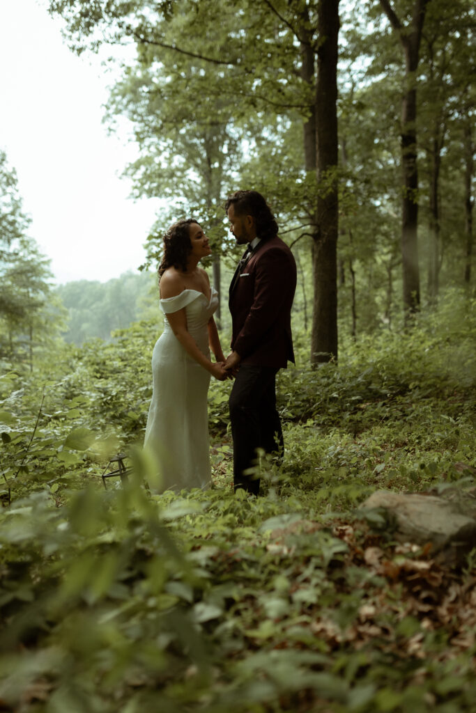 A couple stand in the forest during Shenandoah National Park elopement