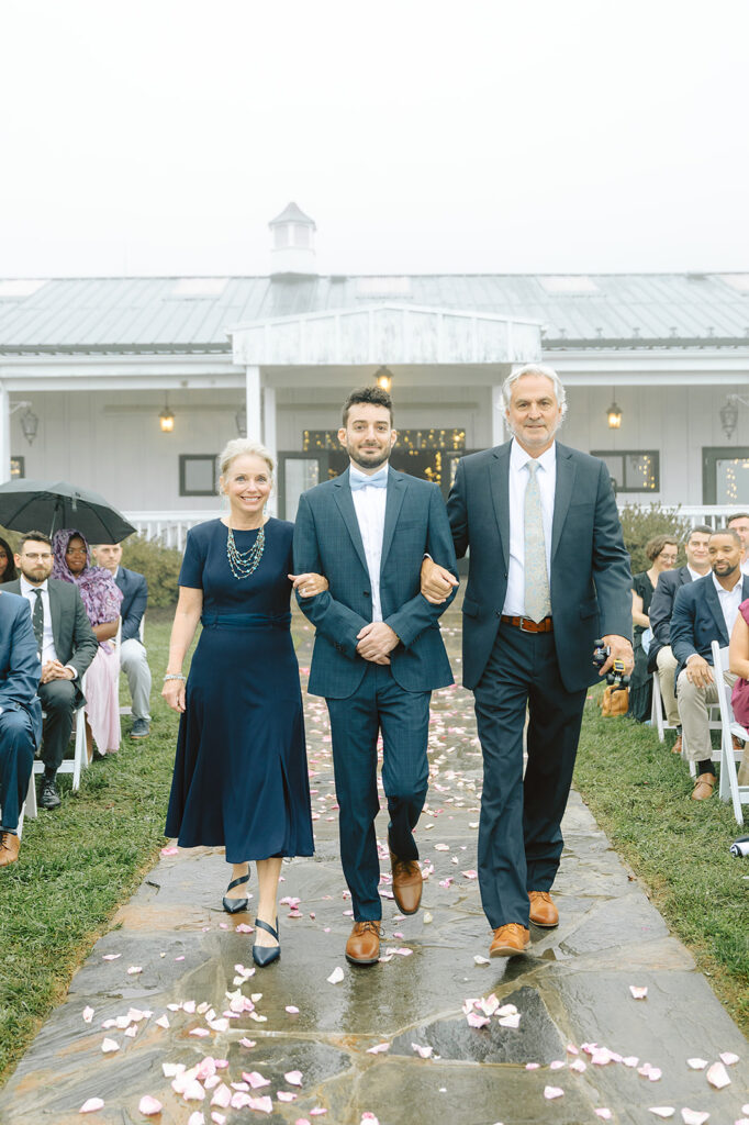 Groom walking down the aisle at Bluemont Vineyard