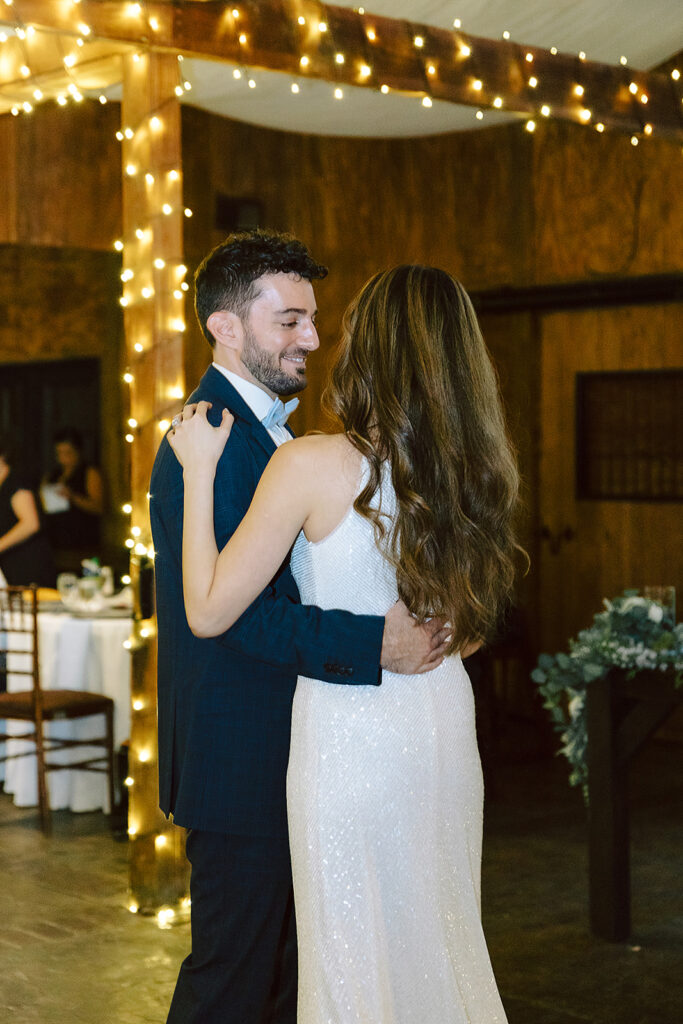 Bride and groom dancing together at The Stable at Bluemont Vineyard